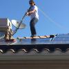 Solar panel cleaning on a two story house